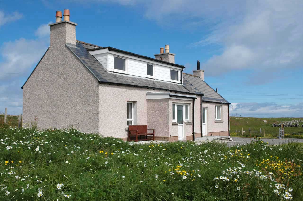 Dollag's Cottage with wild flowers on the croft